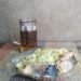Капуста с горбушей на тарелке и кружка пива